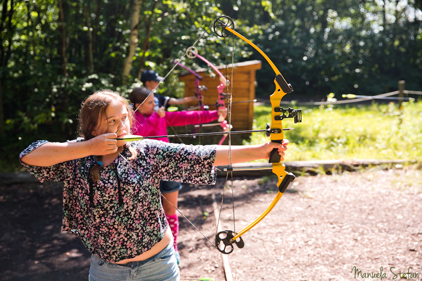 Girls archery at kids camp