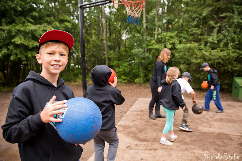 Kids playing basketball at camp